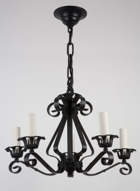 AHL3007
A five light blackened wrought iron chandelier with scrolls and floral details on the openwork body. From the Florida estate of Alfred I. DuPont. Circa 1929.

Dimensions:
Current height: 39-1/2