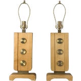 A pair of brass and blond wood table lamps