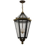 A six sided lantern in brass and black enamel