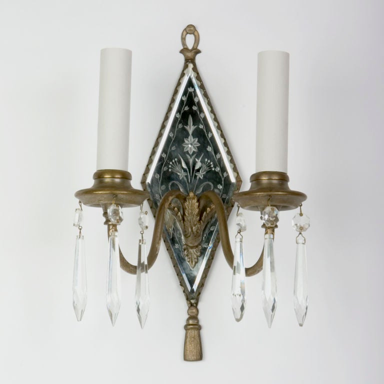 A pair of diamond etched mirrored sconces