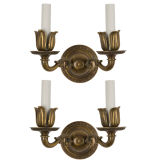 A pair of two arm brass sconces