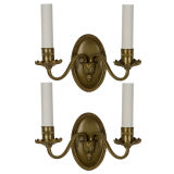 Antique A pair of brass two arm sconces