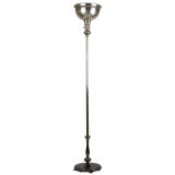 A single silverplated torchiere