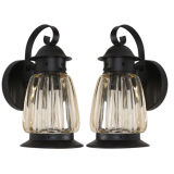 A pair of lobed glass exterior wall lanterns