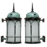 A pair of large cylindrical copper wall lanterns