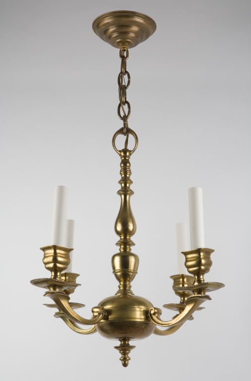 A four arm brass chandelier