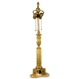 A gilt neoclassical lamp by the E. F. Caldwell Co.