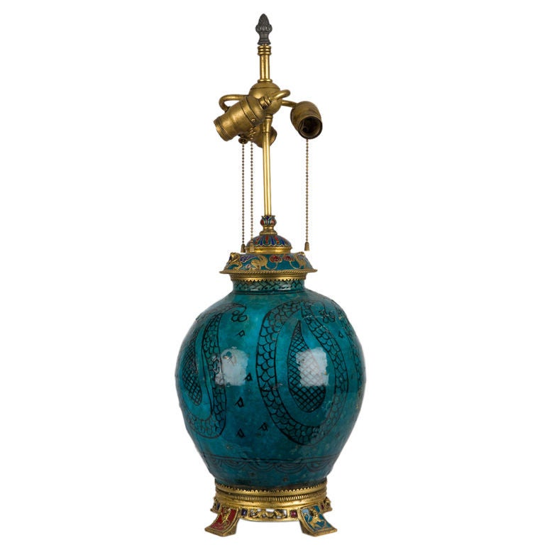 A turquiose ceramic bodied lamp by the E. F. Caldwell Co.