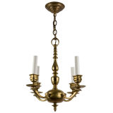 A four arm brass chandelier