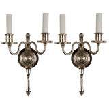 A pair of silvered bronze double-light sconces