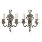 A pair of two-arm sconces