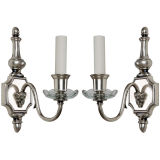 A pair of silverplate rams head detailed sconces