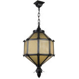 A black enamel and amber glass lantern