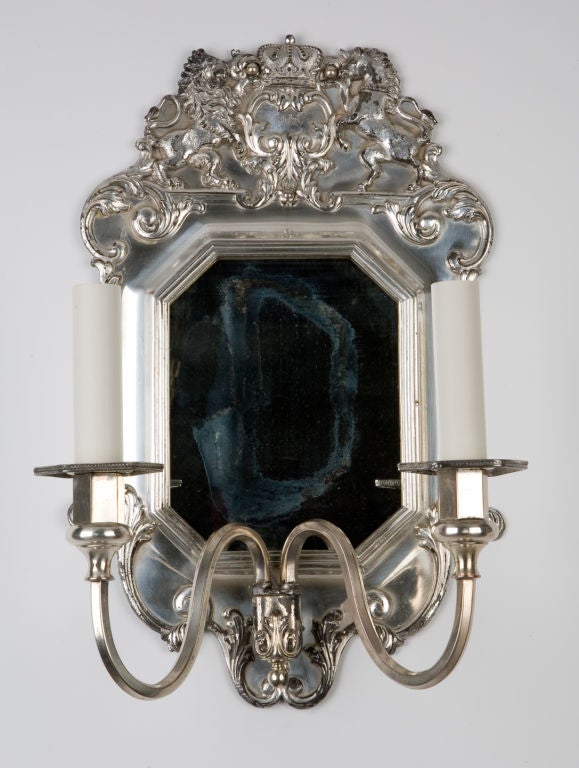 A pair of two arm silver mirrorbacked sconces
