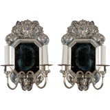 A pair of two arm silver mirrorbacked sconces