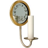 A single mirrored sconce