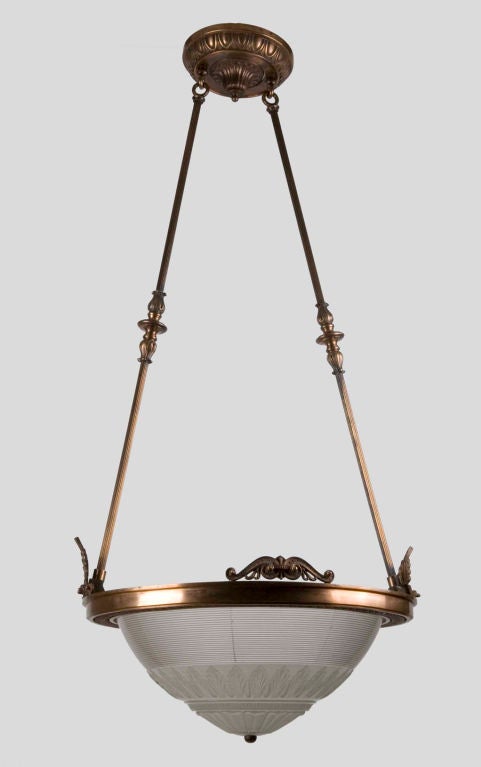A large holophane inverted dome chandelier
