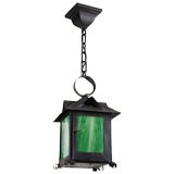 A four-sided lantern with green art glass