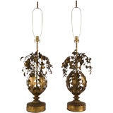 A pair of antique gilded metal foliate lamps