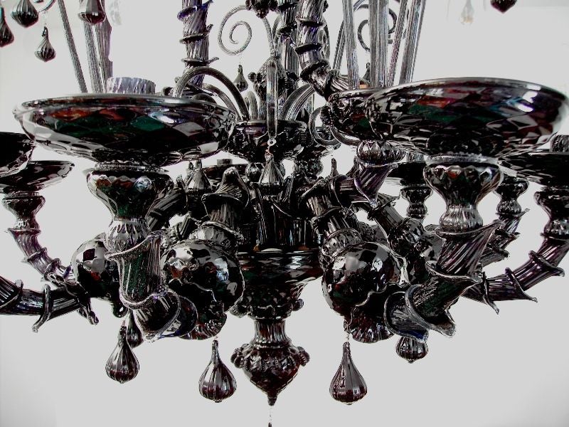 Rare traditional Ca' Rezzonico black Murano Glass chandelier.<br />
9 lights.<br />
The chandelier has been completely re-wired.<br />
The metal is artificially rusted everywhere: this is a thecnique used since the 70's to give the traditional