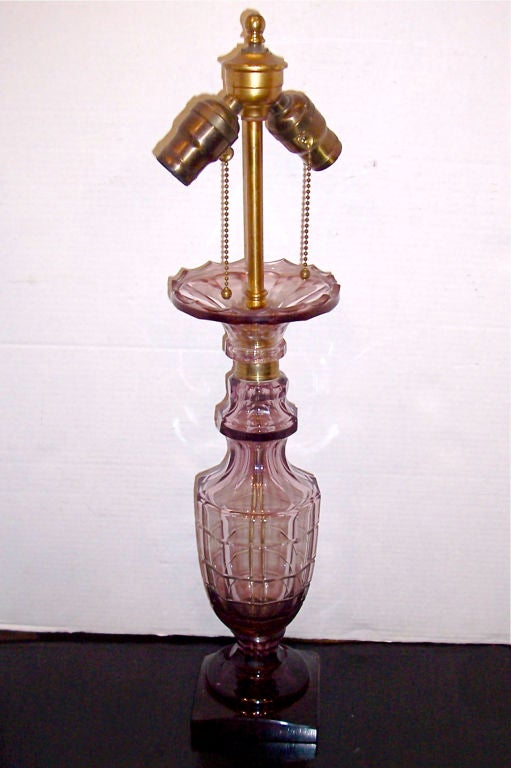 A single, circa 1920s French Art Deco French amethyst colored cut glass table lamp.

Measurements:
Height of body 16