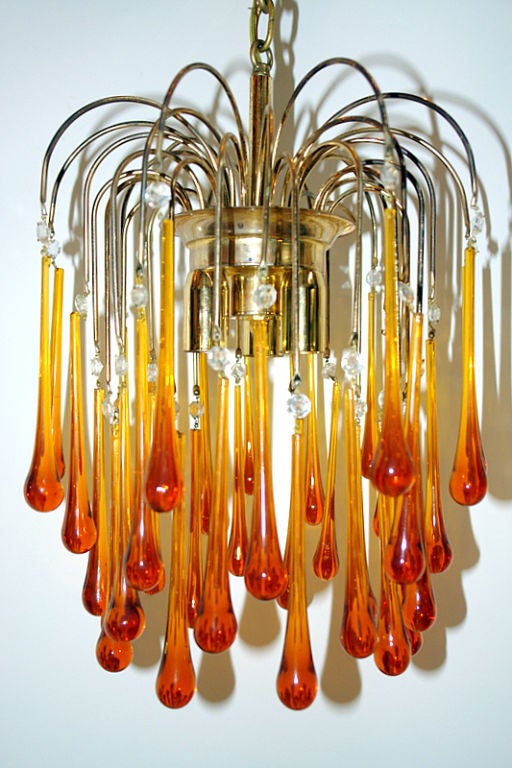 A circa 1950s Italian light fixture with amber glass drops.

Measurements:
Height 21
