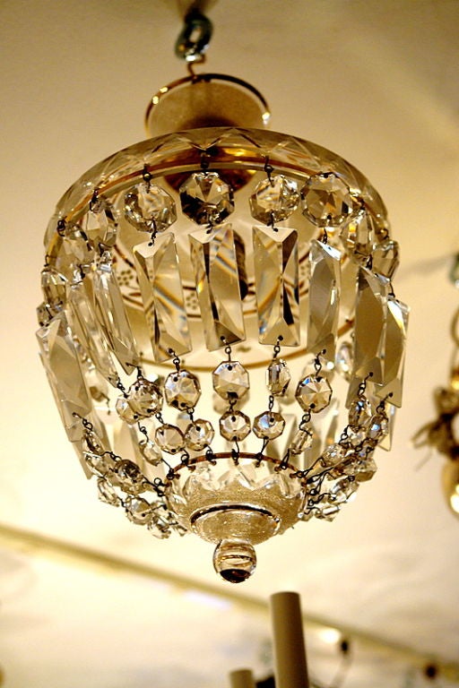 French etched crystal light fixture with interior light, white opaline glass top with gilt details, circa 1920.
Measurements:
Diameter: 8.5