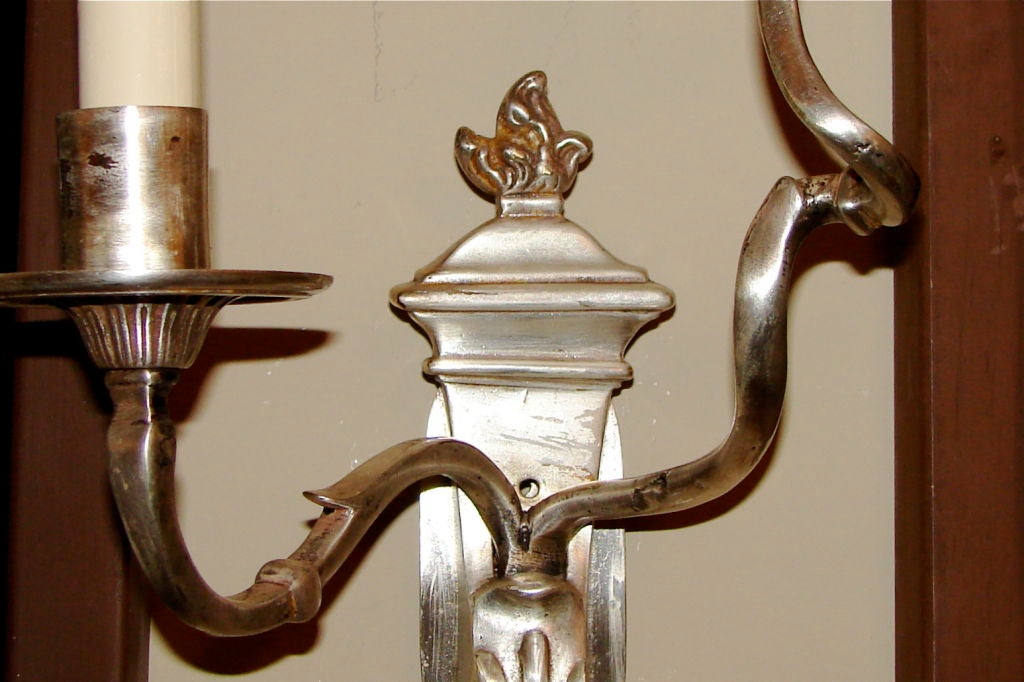 Pair of circa 1920’s silvered bronze Caldwell sconces with scrolling arms.

Measurements:
Height: 14?
Depth: 5.5?
Width: 9?