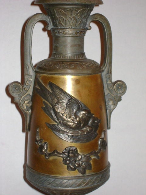 A circa 1920's English bronze and pewter lamp with original patina.

Measurements
Height of Body: 16