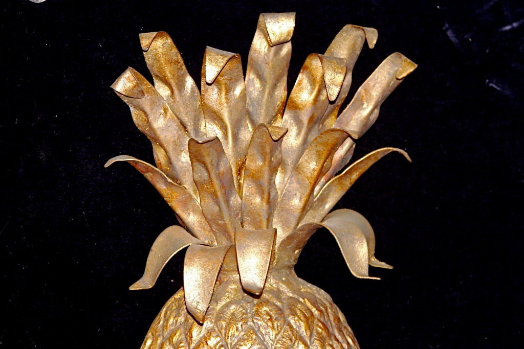 A pair of circa 1940s Italian gilt metal four-light sconces with pineapple motif. Measures: 21