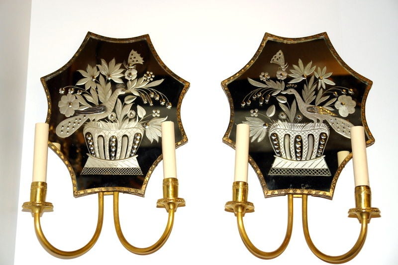 A pair of circa 1920s Caldwell 2-arm sconces with etched mirror back in floral motif. Sold per pair.

Measurements:
Height 17