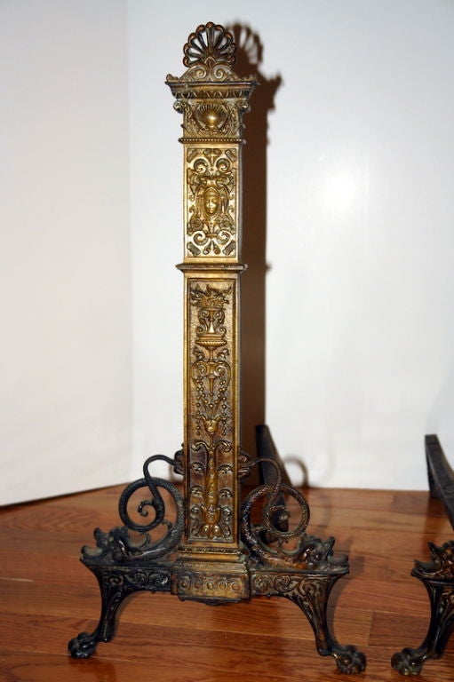 A pair of circa 1900 French Regency style bronze andirons.

Measurements:
Height: 24