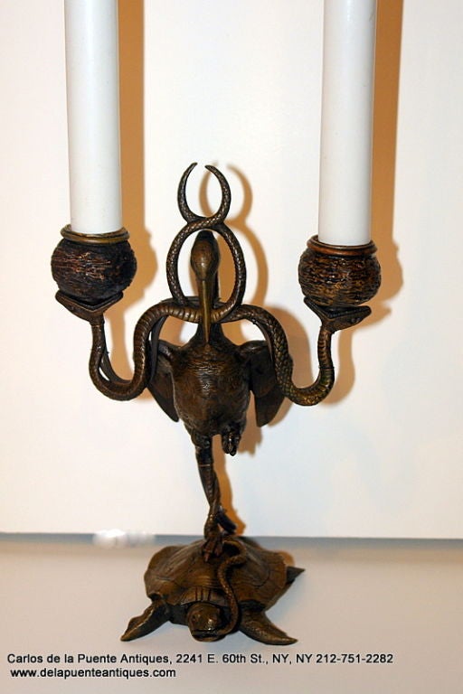 A 19th century Italian candlestick with 2 lights, electrified as a lamp. 

Measurements:
Height: 14