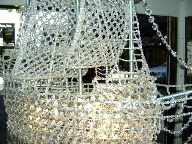 Circa 1930 French crystal chandelier in the shape of a ship. with crystal sails and flags. 8 interior lights.  36