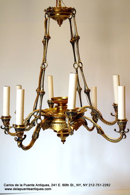 A late 19th Century French Regency style chandelier with original gilt finish. 

Measurements:
Diameter: 20