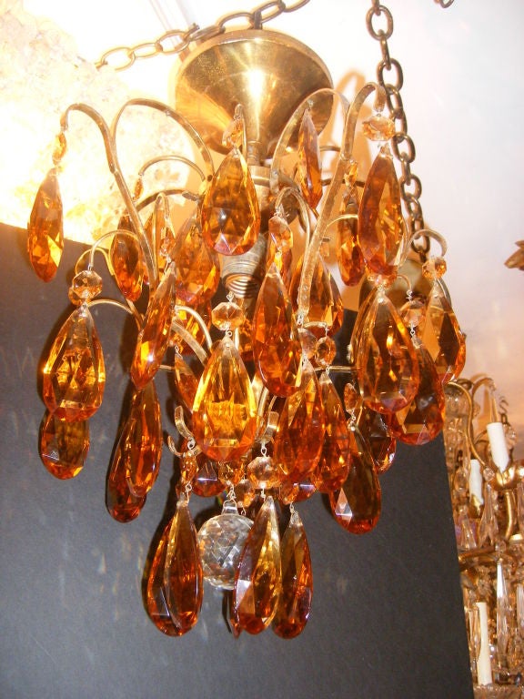 An Italian circa 1960's gilt metal light fixture with amber colored drops and single interior light.

Measurements:
Drop: 19