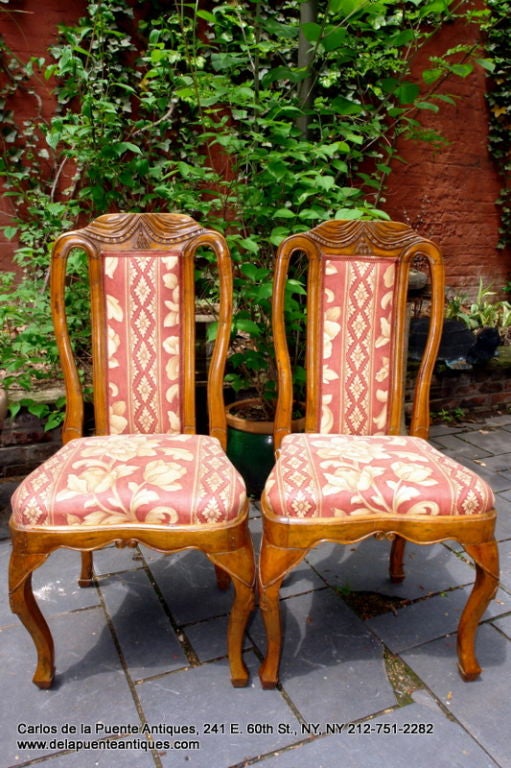 A set of 4 circa 1900’s French walnut chairs with carved detailing.

Measurements:
Height: 40″
Width: 19″
Depth: 17″
