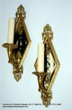 Antique Mirror-backed Bronze Sconces