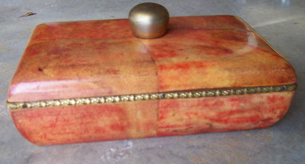 A bronze mounted laquered goatskin dresser box.