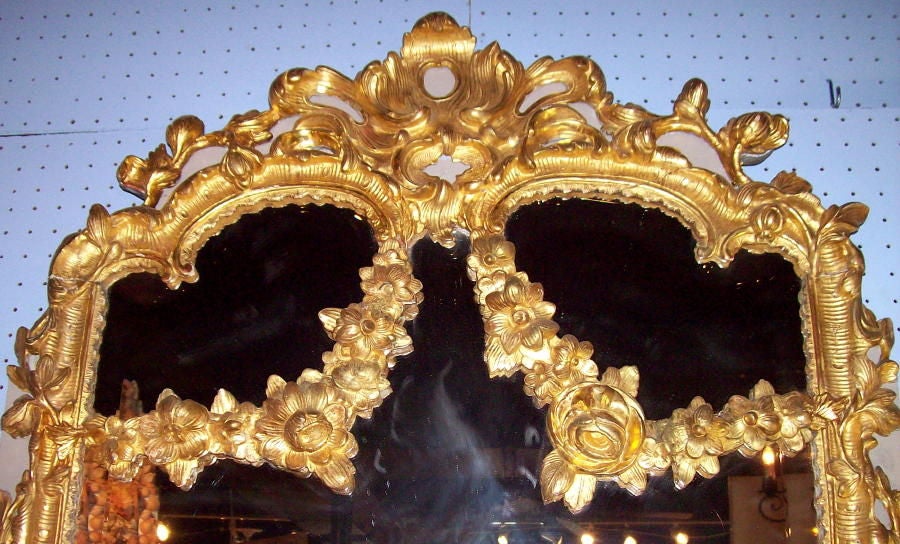 An early 19th Century European Carved, Painted and Giltwood Mirror