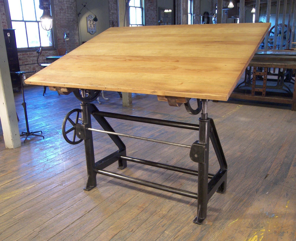 Industrial Cast Iron Drafting Table. Wheels Adjust the Height and Tilt of the Table.  Base Measures 44