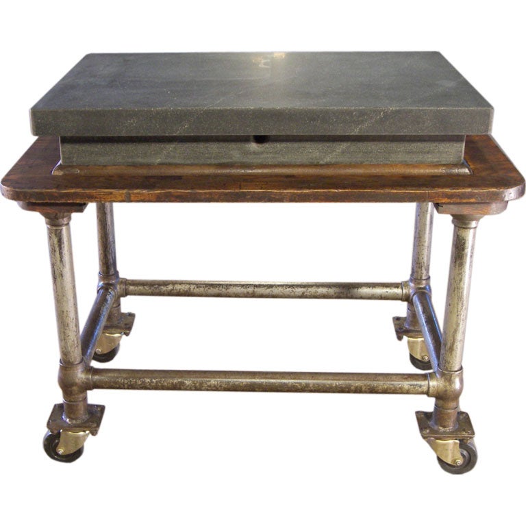 Factory Industrial rolling, serving bar cart, table with 5 5/8″ thick granite slab top. Four swivel castors, Wheels. Stamped 