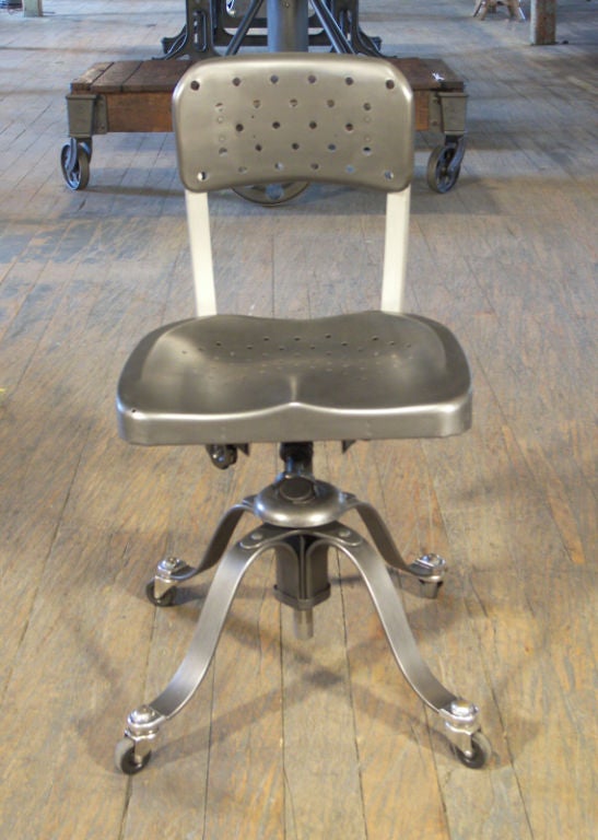 Mid-Century Modern vintage Industrial Remington Rand adjustable chair, seat. Adjustable height, tilt, back. Seat height is adjustable from 30 1/2 - 35". Incredible chair, the bent steel base dips slightly when you sit.