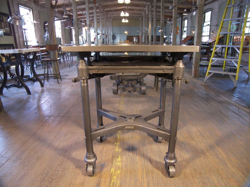 Adjustable Metal Table with Cast Iron Wheels<br />
24