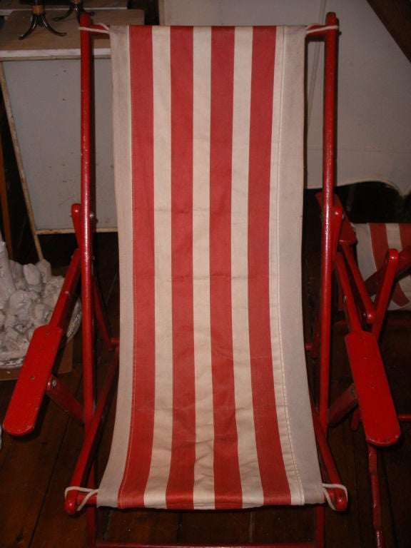 RED PAINTED WOODEN BEACH SLING BACK CHAIRS.  ADJUSTABLE BACKS - WONDERFUL OLD ORIGINAL RED STRIPED CANVAS FABRIC.  27