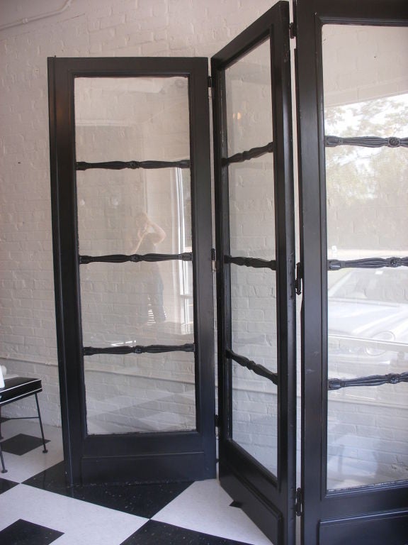 THREE ANTIQUE DOORS PICTURED TOGETHER AS A SCREEN.  SOLD AND PRICED INDIVIDUALLY.  RECENTLY PAINTED BLACK.  2 DOORS ARE 34.5