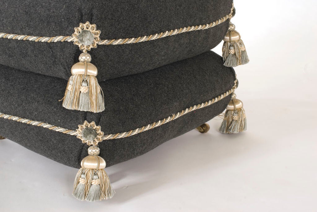 Amazing two-tiered square poof on casters. Completely re-upholstered featuring lovely frogs, tassels and welt cord.