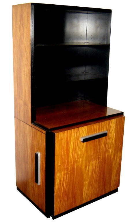This very rare American art deco bookcase was designed ca. 1935 by Donald Deskey (1894 – 1989) for the Widdicomb Furniture Company of Grand Rapids, Michigan.  The case, which features three open shelves above a rectangular base with four drawers on