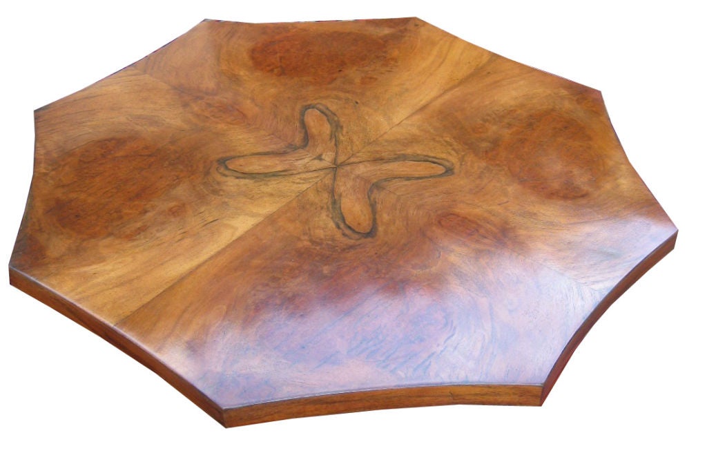 This French art deco table dates from the 1930's and the veneer on the top is sectioned to create a 