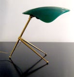 Elegant 1950's tripod brass desk lamp with winged shaped shade.